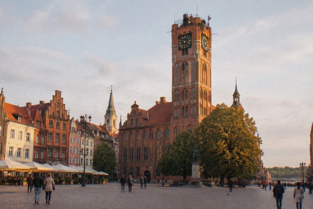 Gothic brick townhouses and the town hall tower of the Old Town of Toruń seen from the market square