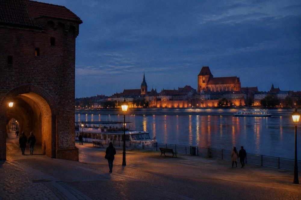 Evening light on the Vistula with the walled skyline of Toruń in the background