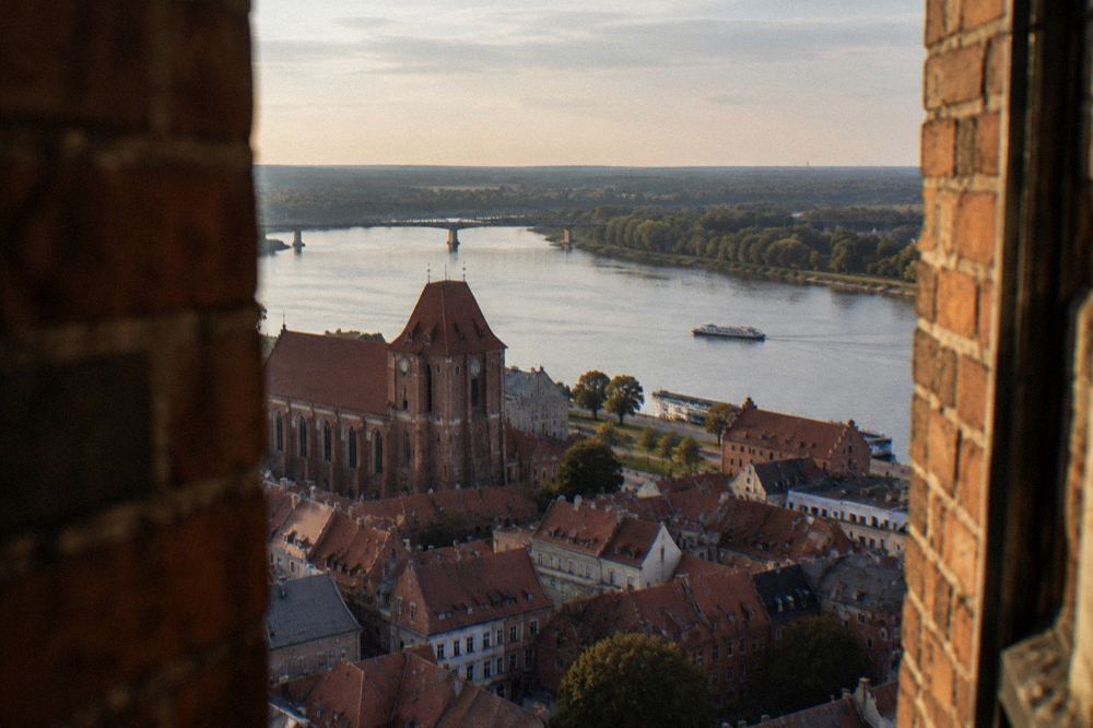 View from a high tower over red rooftops and the Vistula river