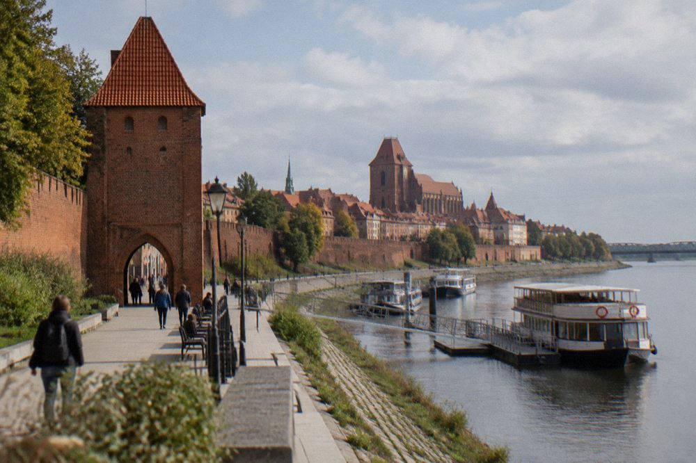 Riverside promenade below the brick town walls on the Vistula in Toruń