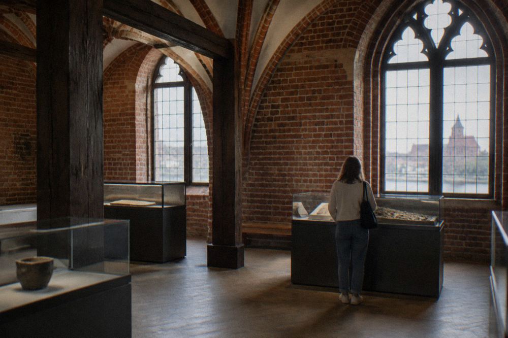 Interior of a Gothic townhouse museum with timber ceilings and medieval burgher rooms