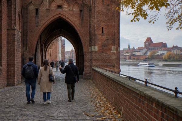 A private guide leading a medieval-town walking tour in Toruń