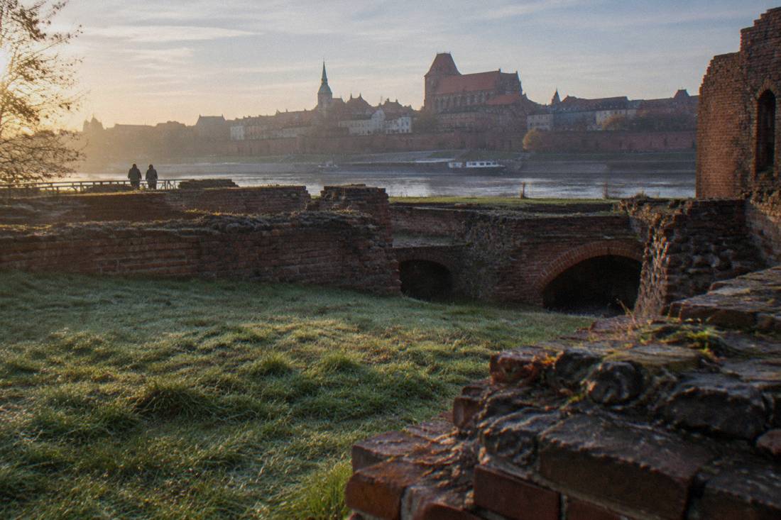 Low brick ruins of the Teutonic castle in Toruń