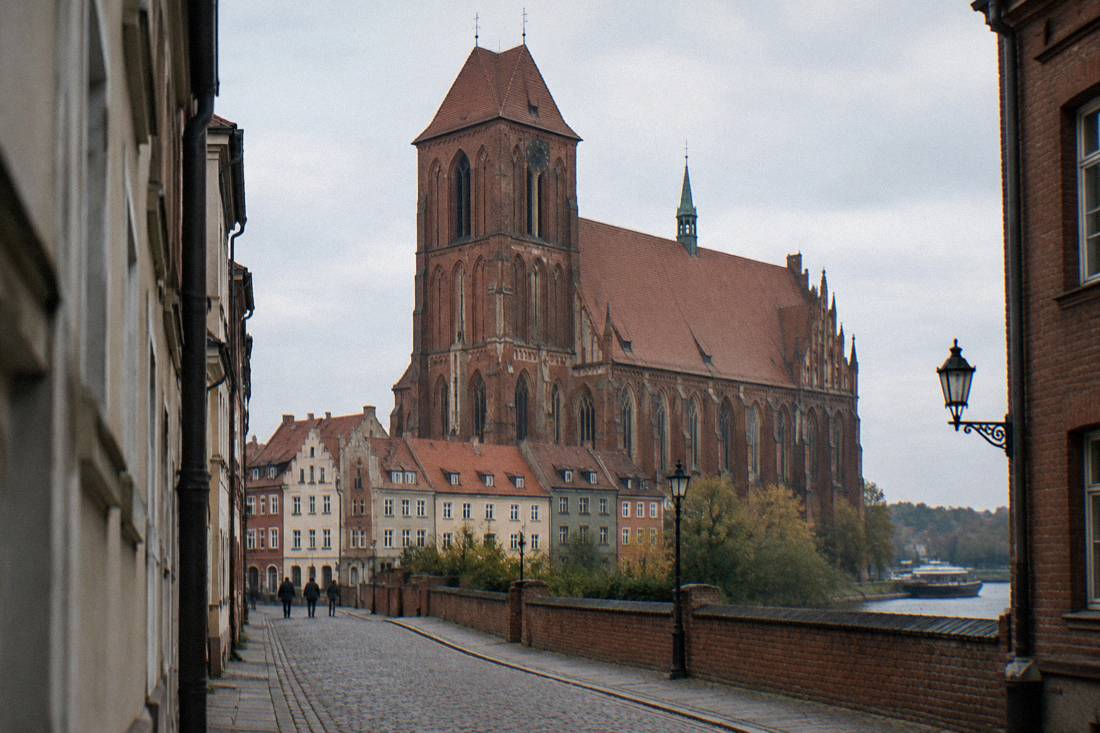 The Gothic brick cathedral of Toruń rising above surrounding townhouses