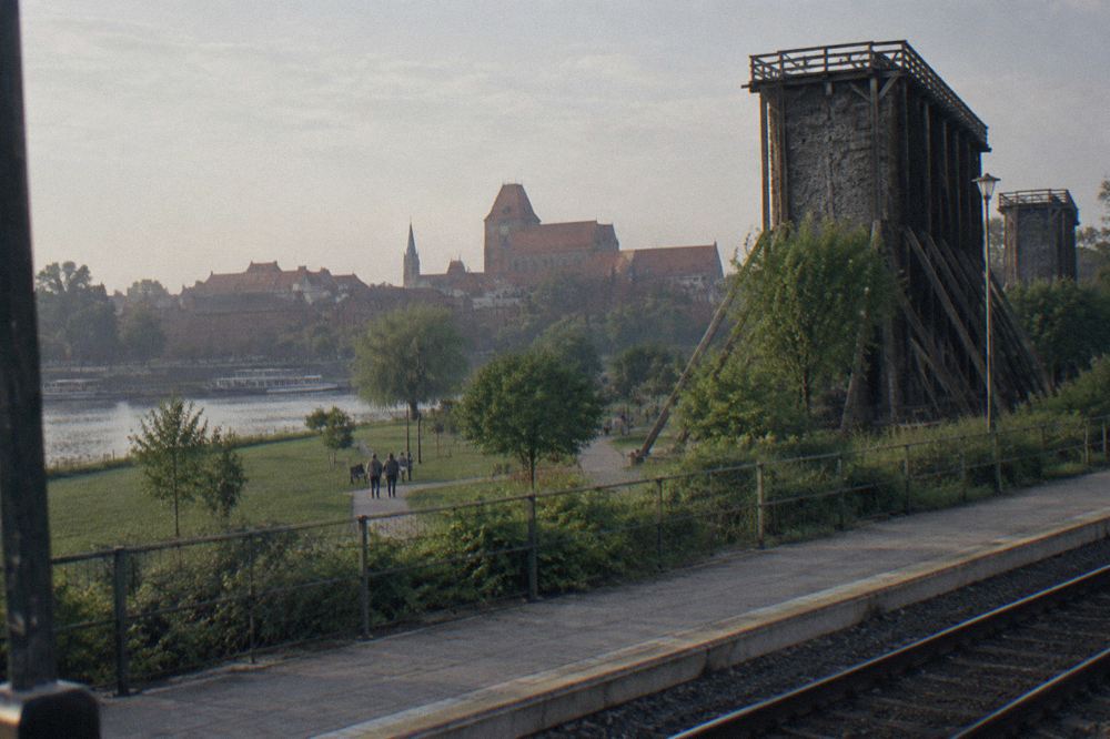 Wooden graduation towers rising over a park in a Polish spa town