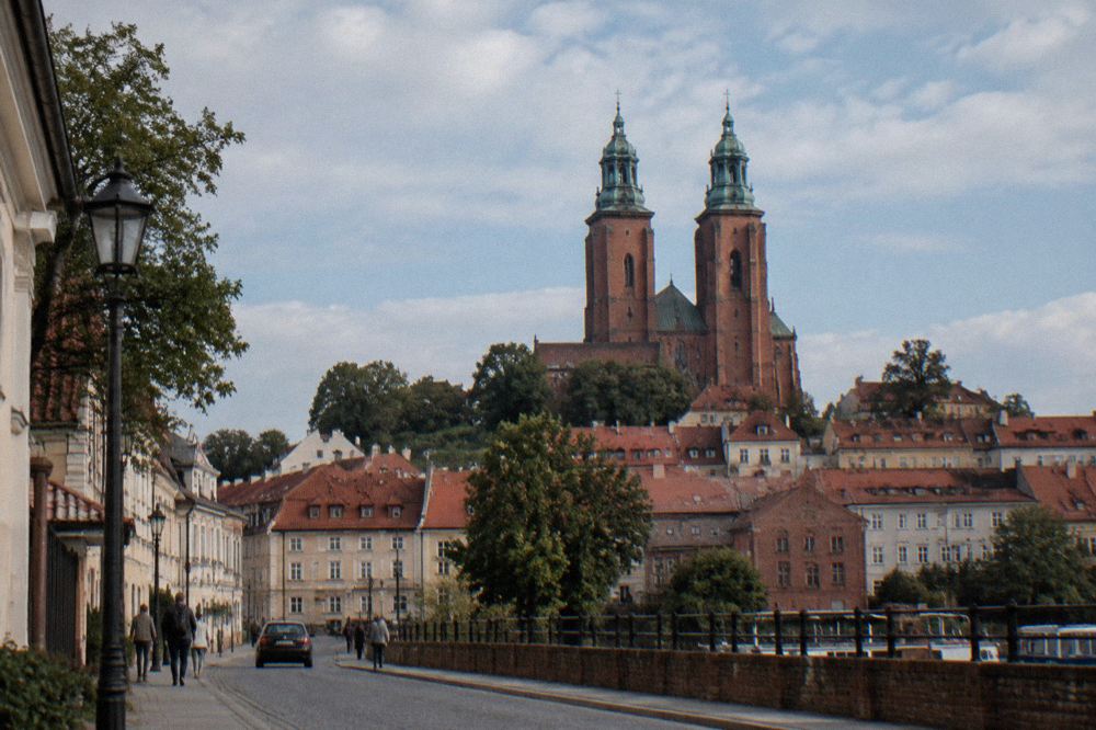 The towers of the Cathedral Basilica in Płock above the old town rooftops