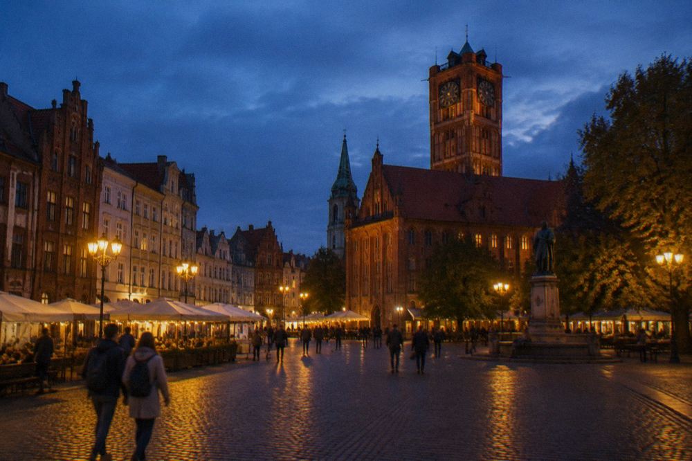 Old Town market square in Toruń lit up after dusk
