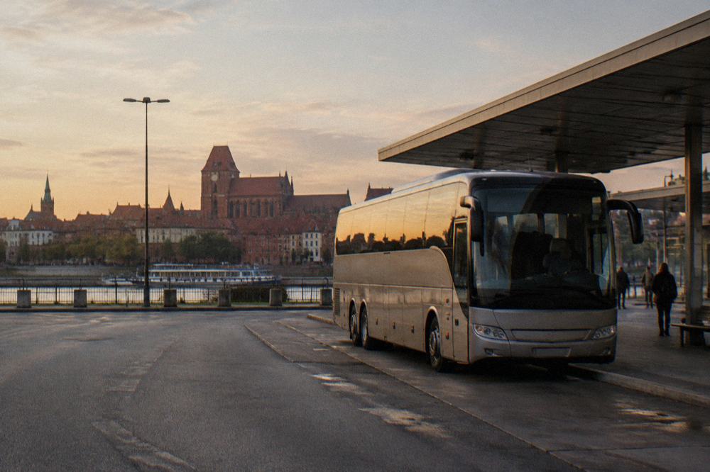 A long-distance coach parked at a Polish bus station bay