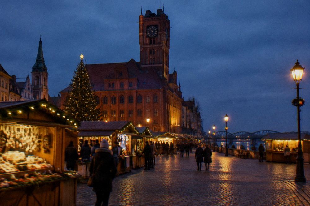 Festive wooden market stalls with lights on a dark evening square