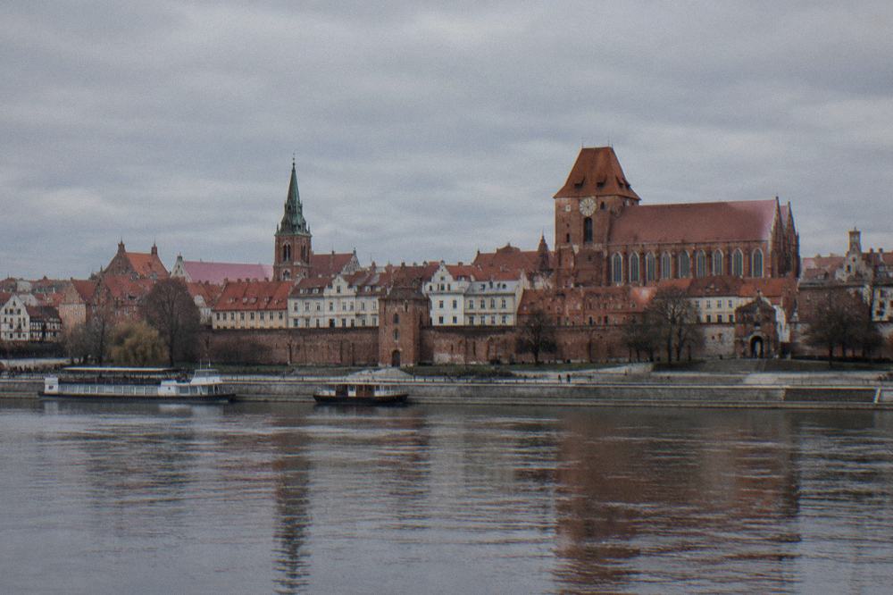 The red brick Gothic buildings of Toruń Old Town seen from across the Vistula river