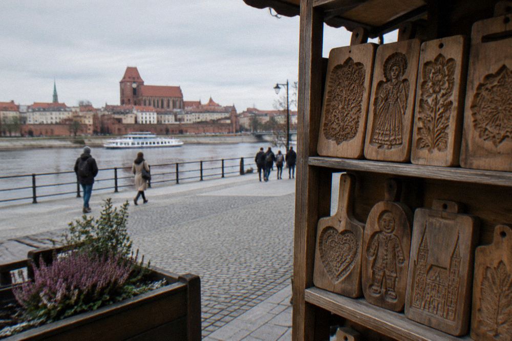 Wooden gingerbread moulds with carved patterns displayed on a shelf