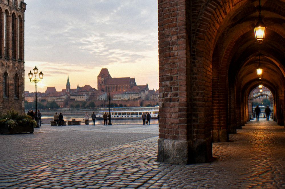 Brick vaulted passages of a nineteenth century Prussian fort lit by lamps
