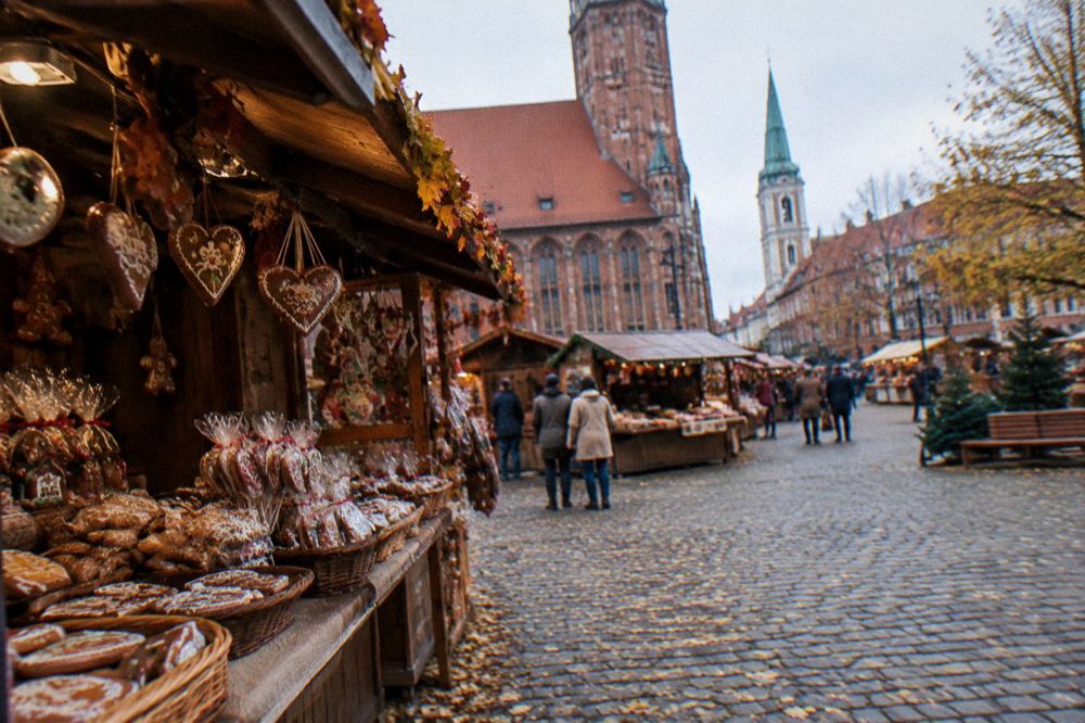 Market stalls with gingerbread and sweets on the Old Town square in autumn