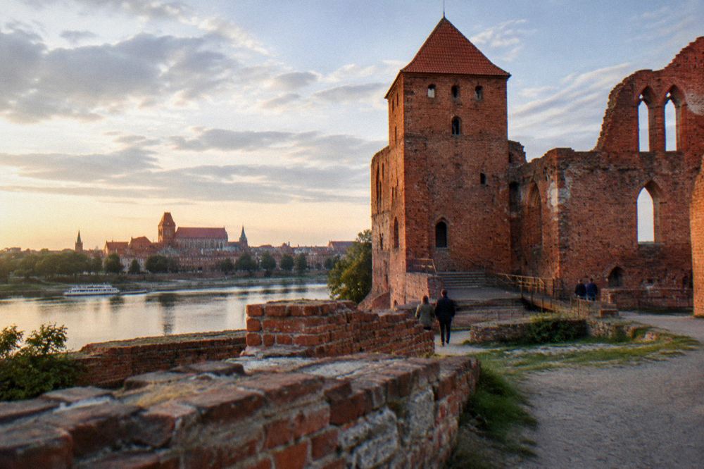 The red brick ruins of the Teutonic castle in Torun under an open sky